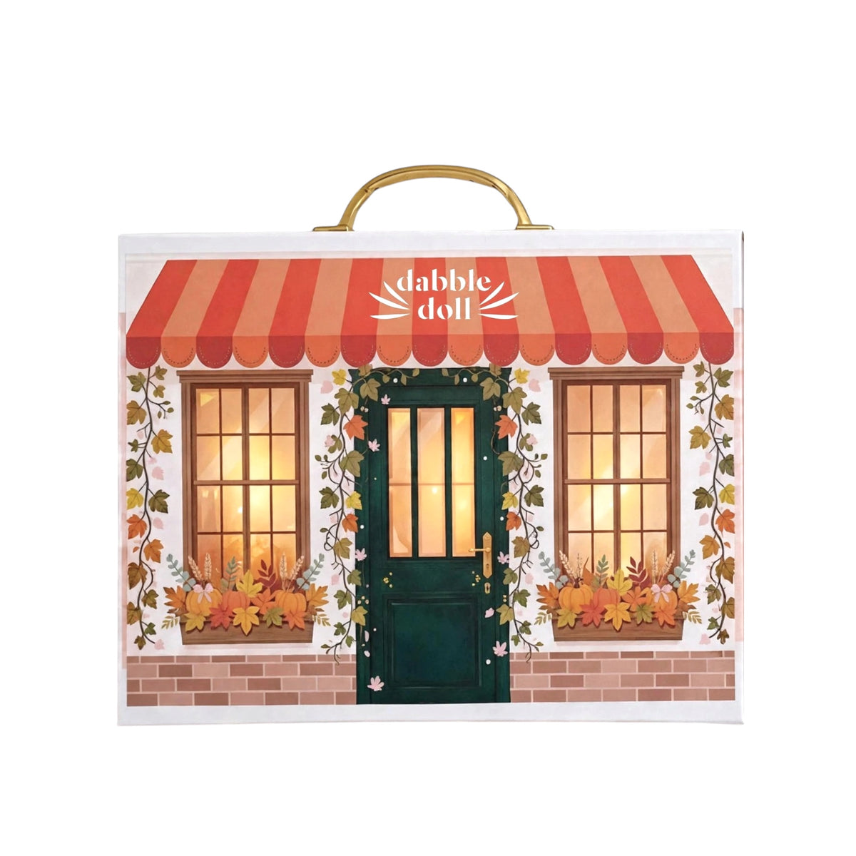 Luxury fall pumpkin thanksgiving cozy gift box featuring an illustrated storefront facade with a red-and-orange awning, green door, two warm window lights, autumn leaves, and a gold carrying handle on top.