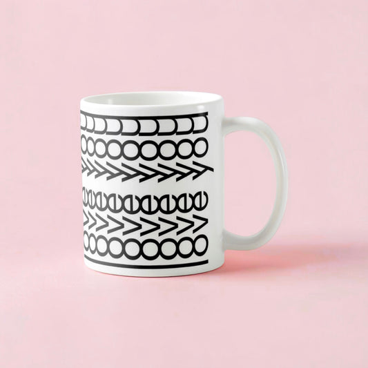 Dabble Doll Gift Box featuring a stylish coffee mug with black geometric patterns