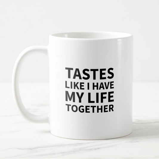 Dabble Doll coffee mug with bold text stating TASTES LIKE I HAVE MY LIFE TOGETHER