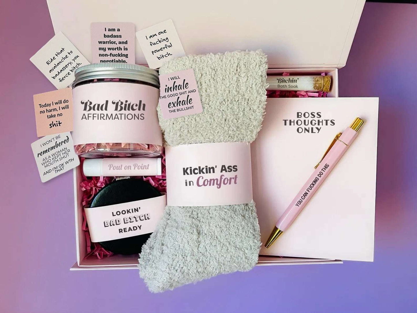 Dabble Doll gift box featuring a badass bitch motivational jar with affirmations, cozy socks, and a Boss Thoughts Only notepad