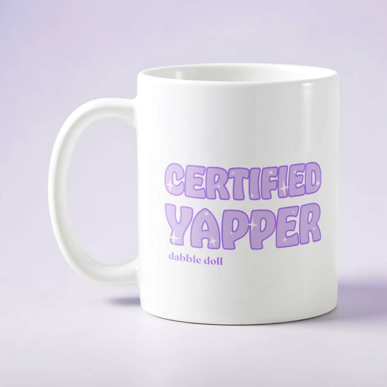 White Dabble Doll coffee mug novelty with 'Certified Yapper' text in purple font