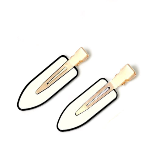 Dabble Doll creaseless clips for styling hair with gold metal clasp and white padding