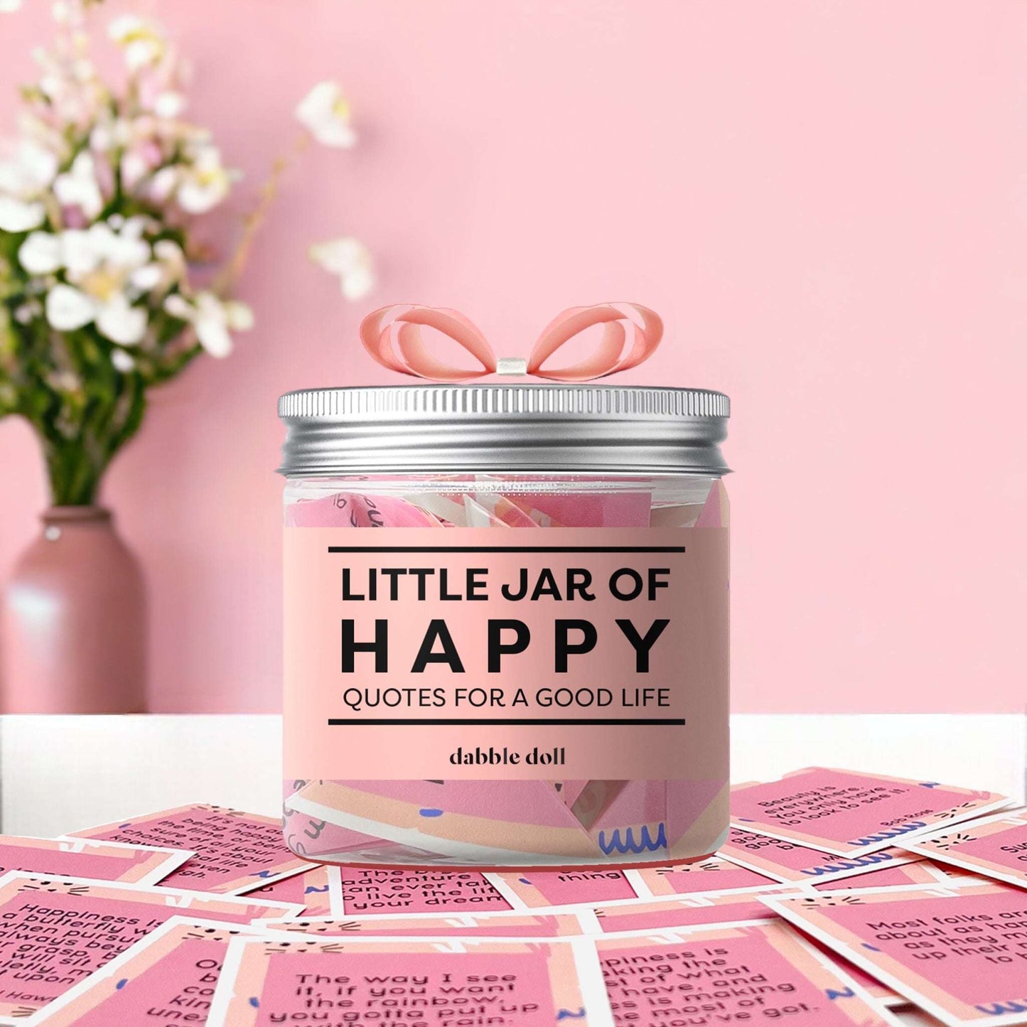 Happy jar gift box filled with inspiring quotes for a good life from Dabble Doll with a pink background