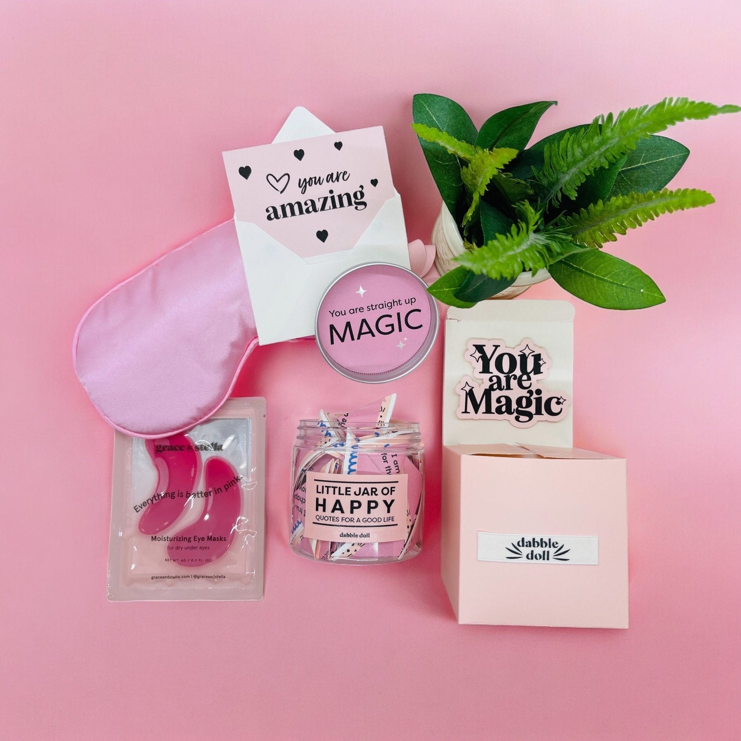 Dabble Doll happy jar gift set with motivational cards eye mask and plant on pink background