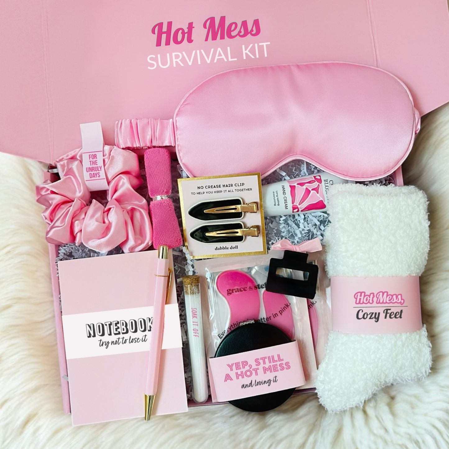 Dabble Doll hot mess survival kit gift box with pink sleep mask cozy socks hair clips and notebook