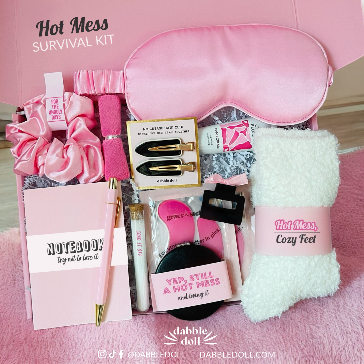 Dabble Doll hot mess survival kit gift box with pink sleep mask cozy socks notebook and hair accessories