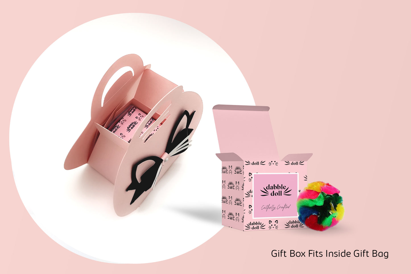 Dabble Doll luxury cat toy gift box in pink with black accents and colorful pom pom toy