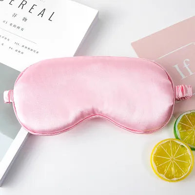 Dabble Doll pink silky sleep mask made of smooth satin fabric for comfortable restful sleep