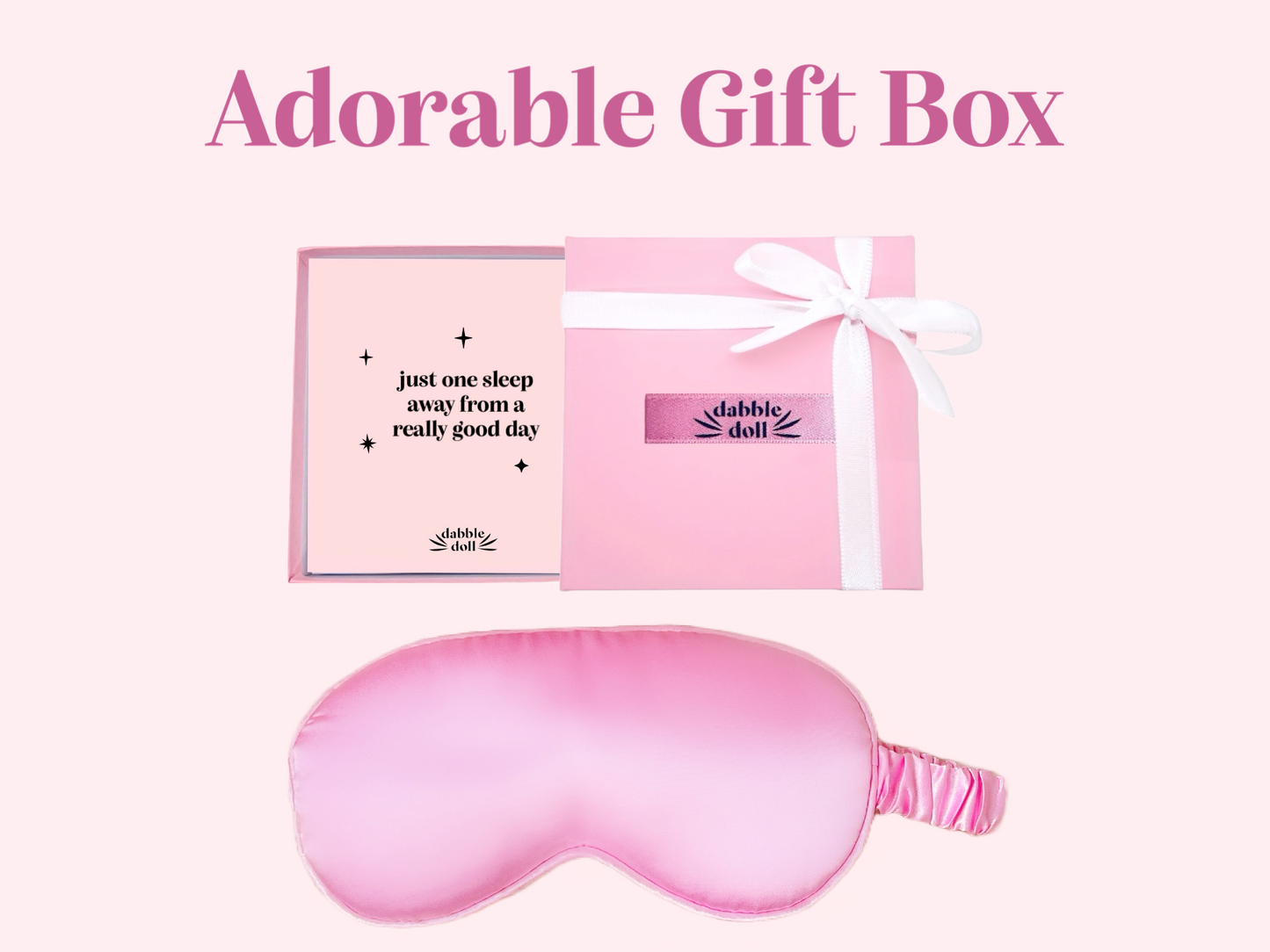 Dabble Doll adorable gift box with a pink silky sleep mask and white ribbon