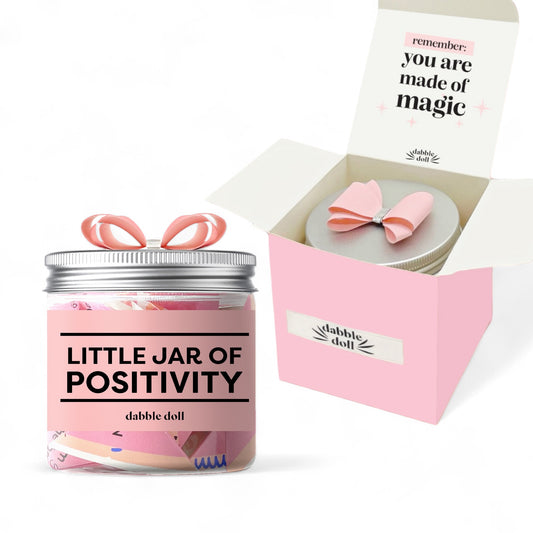 Dabble Doll positivity jar gift with pink label and message jar in pink box with bow on lid