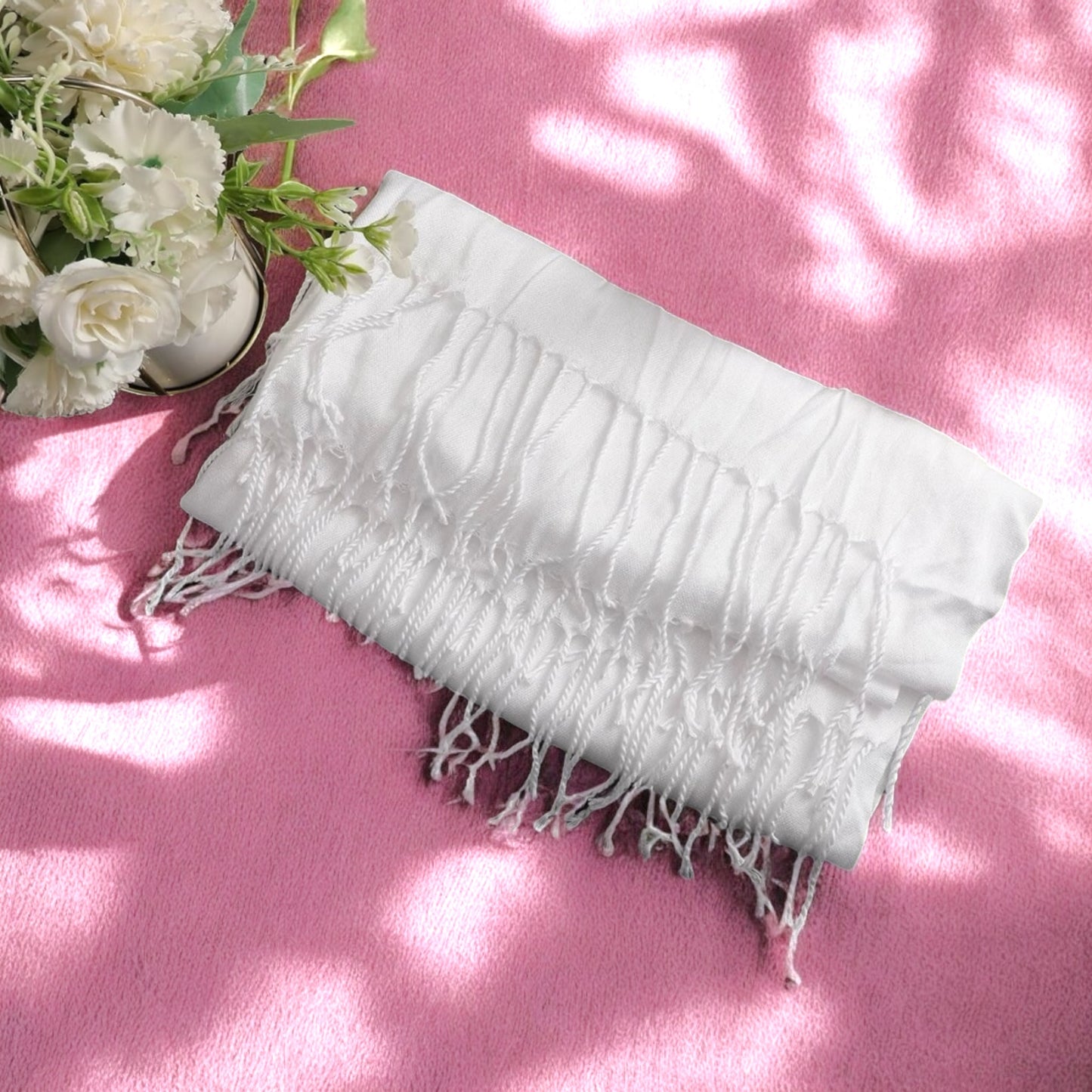Thinking of you gift box for her includes a soft white fringed scarf on pink background with white flowers