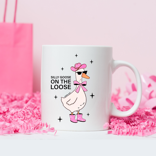 Funny coffee mug featuring a silly goose in sunglasses and a bow, perfect for humorous gift giving