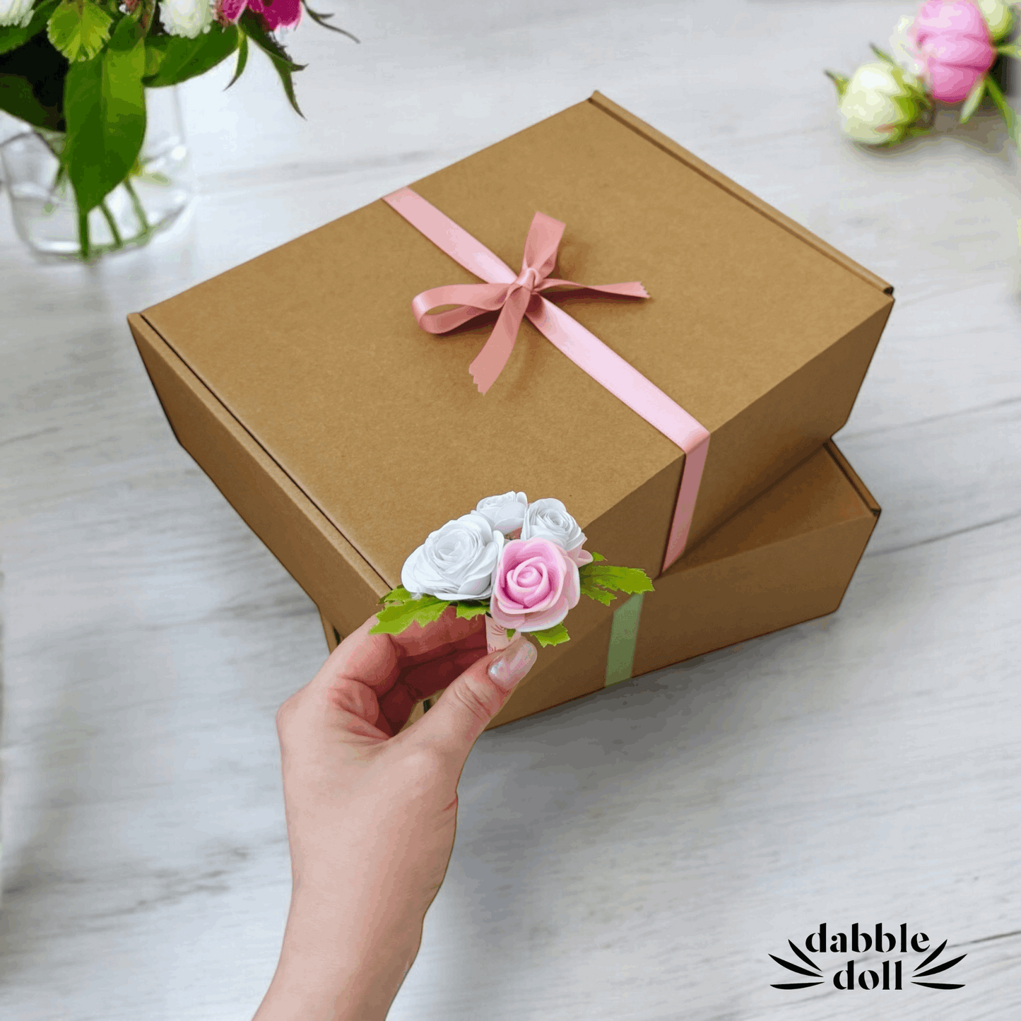 Elegant brown gift box with pastel ribbons, perfect for girls and women, crafted by Dabble Doll