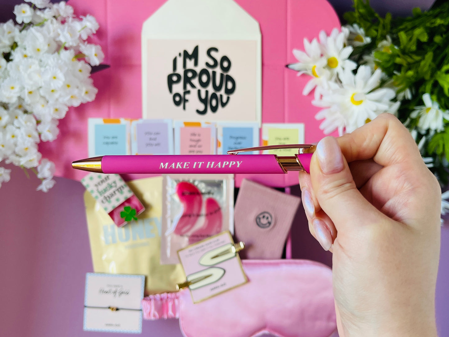 Dabble Doll pink gift box for girls featuring a stylish pen and cheerful notes