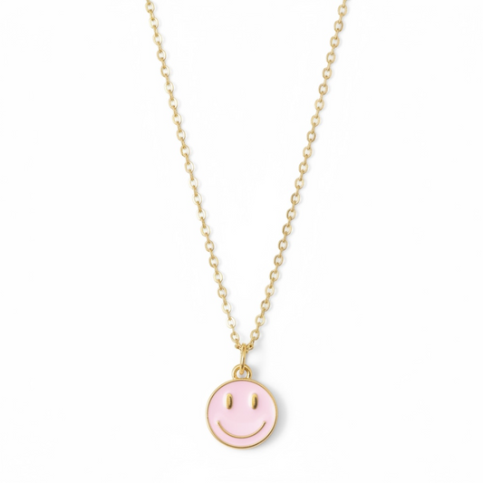 Dabble Doll necklace smiley face in gold with a pink enamel charm for cheerful style