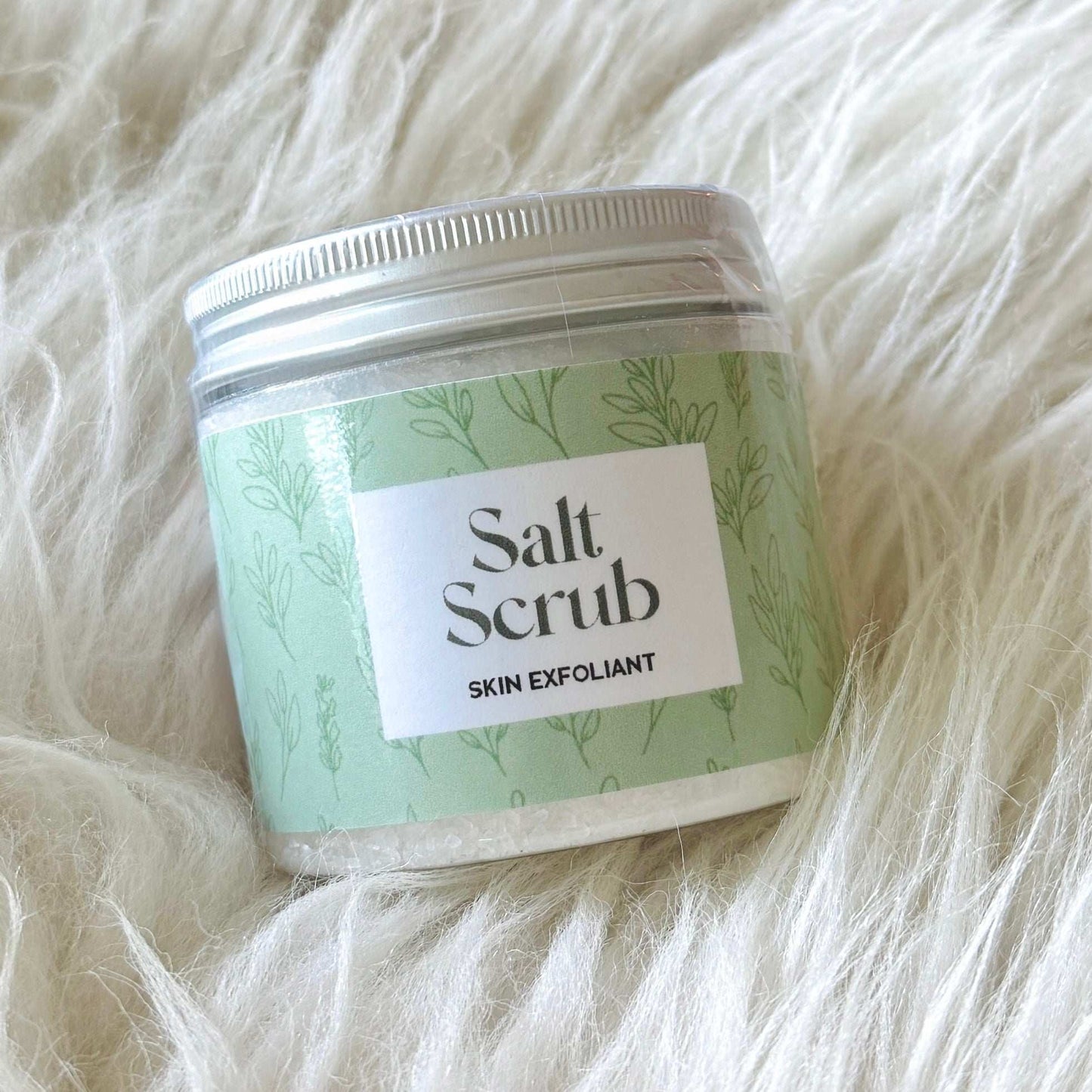 Dabble Doll Salt Scrub Exfoliant in a green jar, perfect for girls and women for smooth skin
