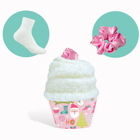 Dabble Doll Pink Scrunchie displayed on a festive cupcake-shaped container with holiday designs