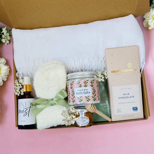 Dabble Doll self care gift box for her with bath salts, milk chocolate, honey, mist spray, and soft towel