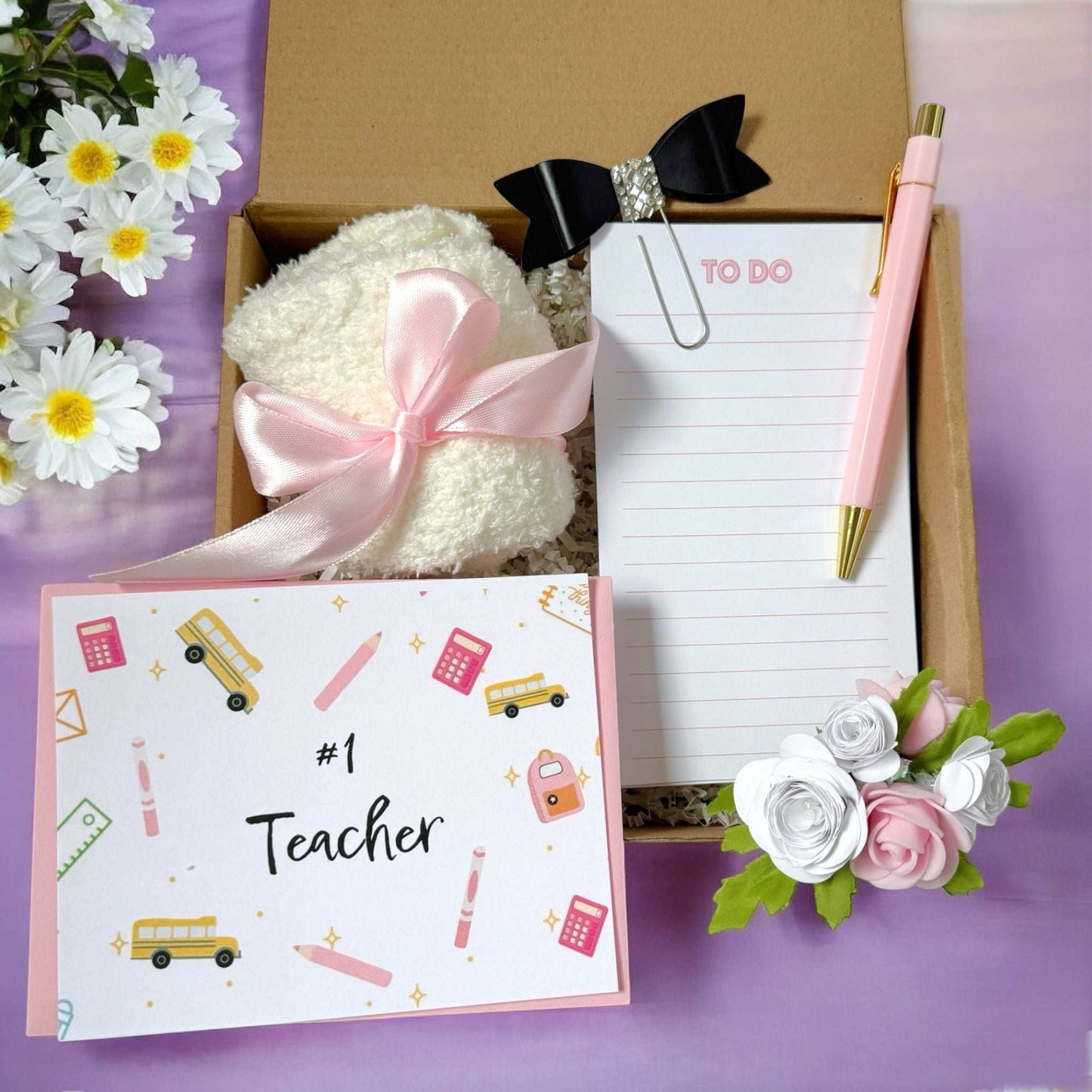 Dabble Doll teacher appreciation gift basket with cozy towel, pink pen, to-do list, and decorative flowers