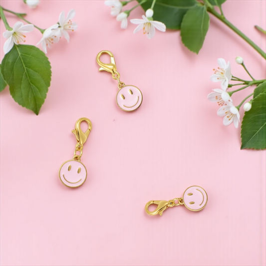 Dabble Doll zipper charm featuring a gold smiley face design, perfect for personalizing bags or accessories