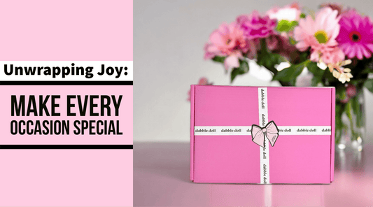 Pink gift box arrangement perfect for girls and women featuring a floral backdrop