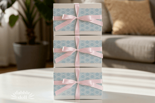 Gift boxes in pastel blue with pink ribbons, perfect for girls and women celebrating special occasions.