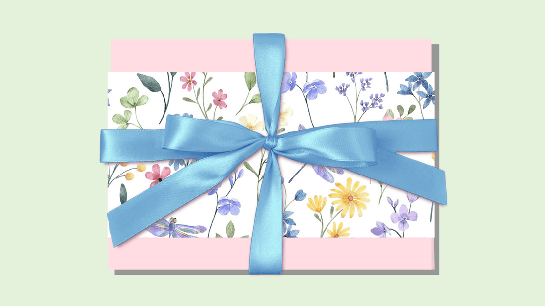 Sunshine in a box gift for girls and women featuring a floral design with a blue satin ribbon