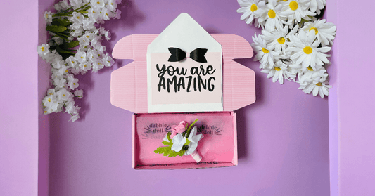 Pink gift box for girls featuring a floral embellishment and a heartfelt card saying You Are Amazing