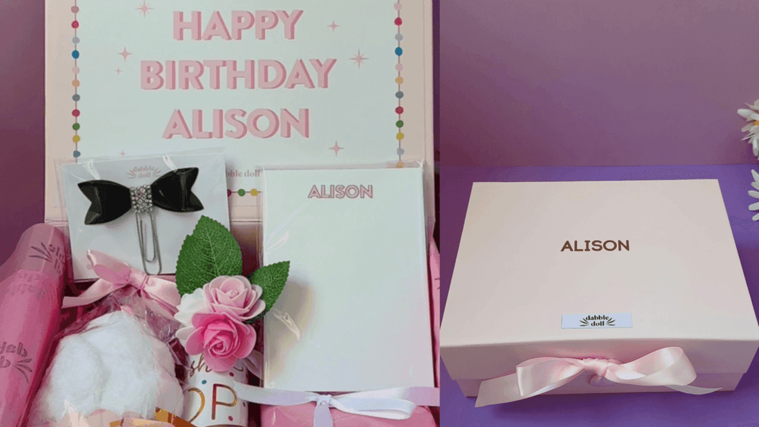 Personalized happy birthday gift boxes for women featuring a pink theme, stationery, and decorative accessories