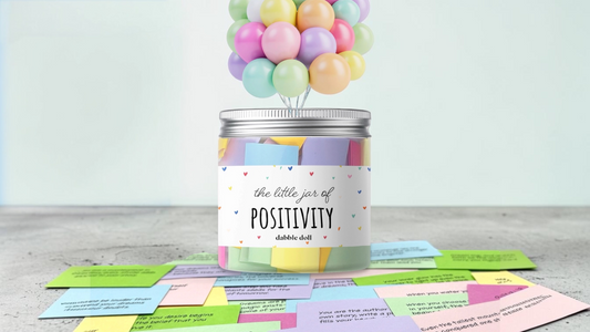 Dabble Doll positivity jar filled with mental wellness quote cards for daily encouragement