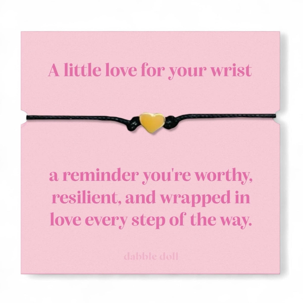 Dabble Doll bracelet chrome heart on a pink card with an inspirational message about self-worth