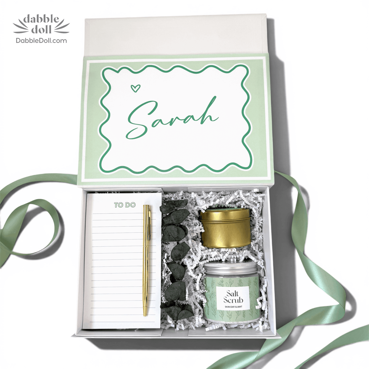 Personalized gift box from Dabble Doll with salt scrub, notepad, and pen for special occasions
