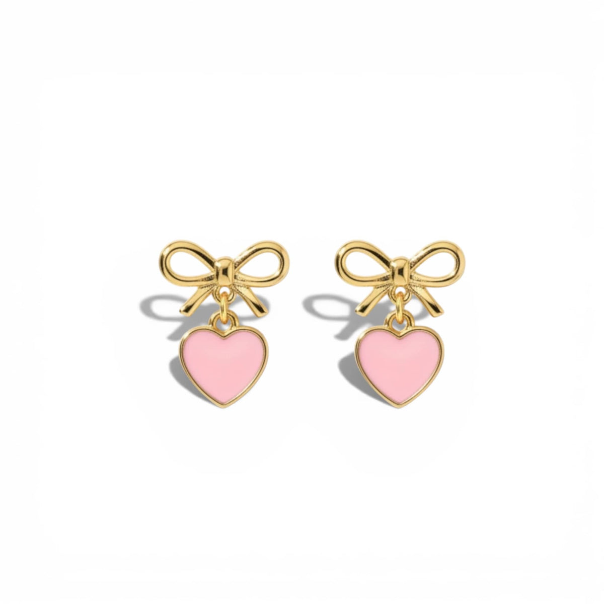 Gold Dabble Doll heart earrings with pink enamel hearts and delicate bow details