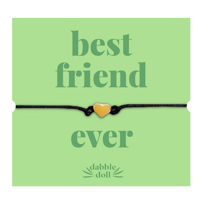 Bracelet with heart charm on a green card with 'best friend ever' message card, friendship bracelet