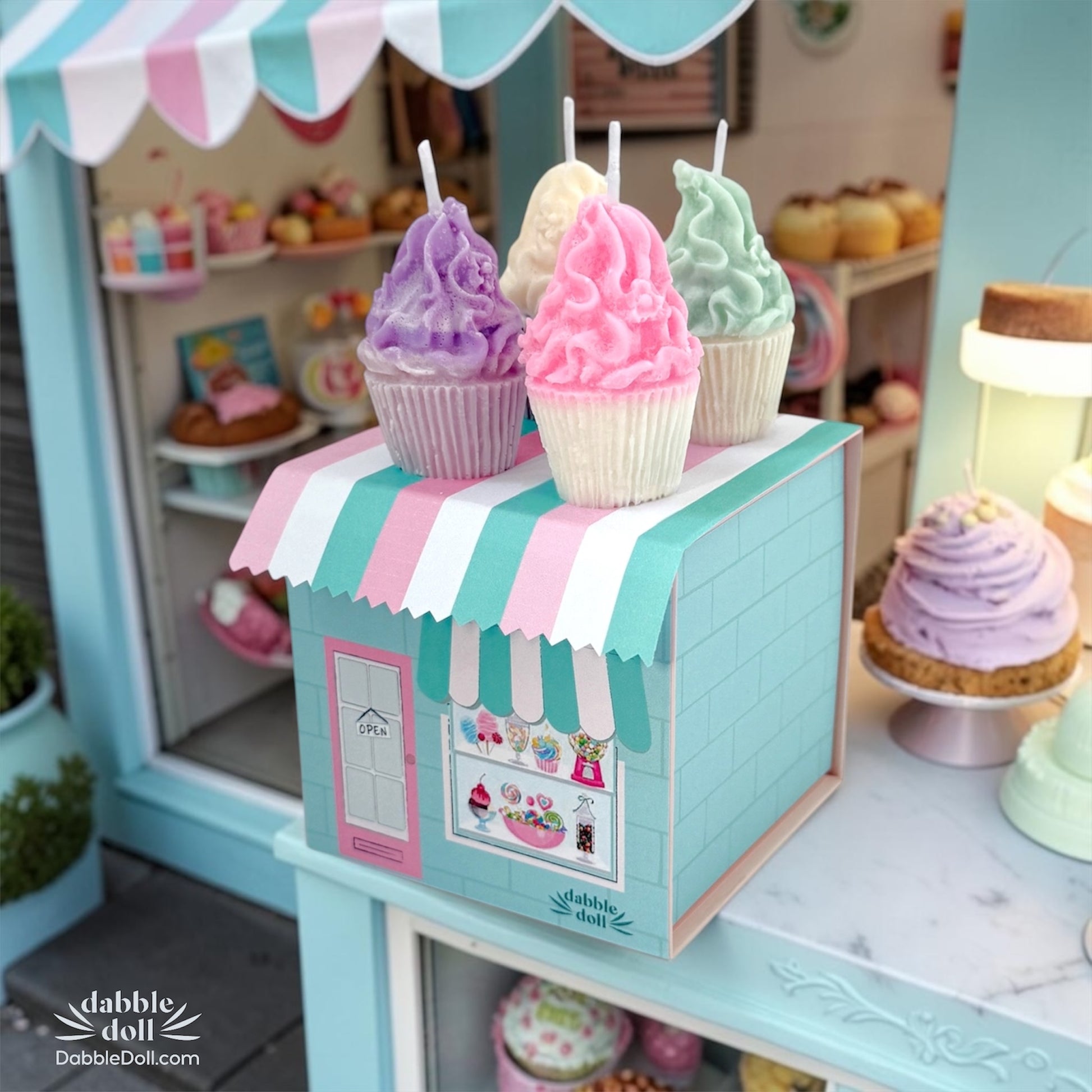 Miniature ice cream stand with colorful ice cream cones in a toy store setting.