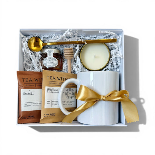 Gift set with tea, candle, and spoon in a box