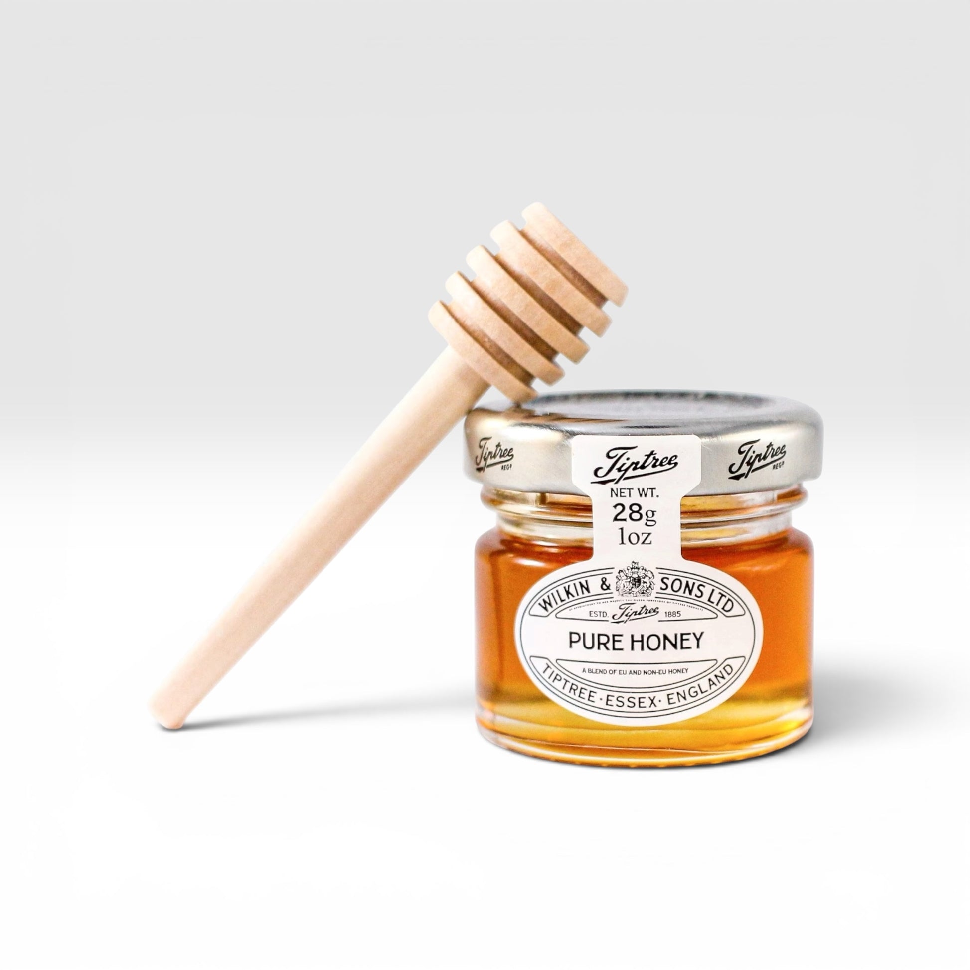 Honey jar with wooden dipper