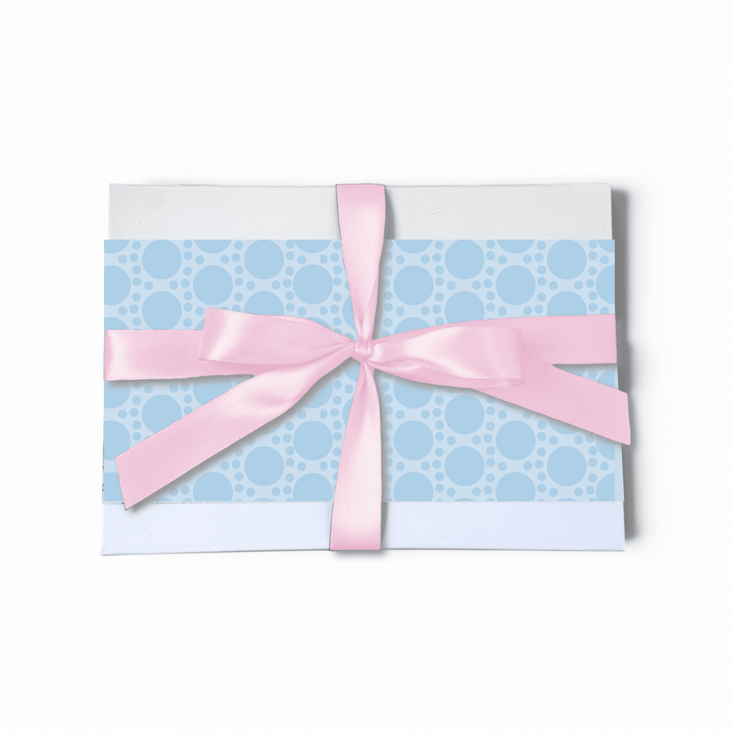 Gift card with blue polka dot pattern and pink ribbon on a white background