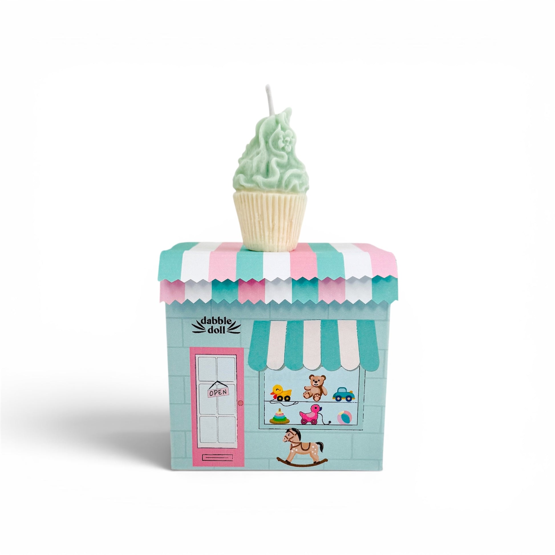 Toy store with a cupcake-shaped candle on top against a white background