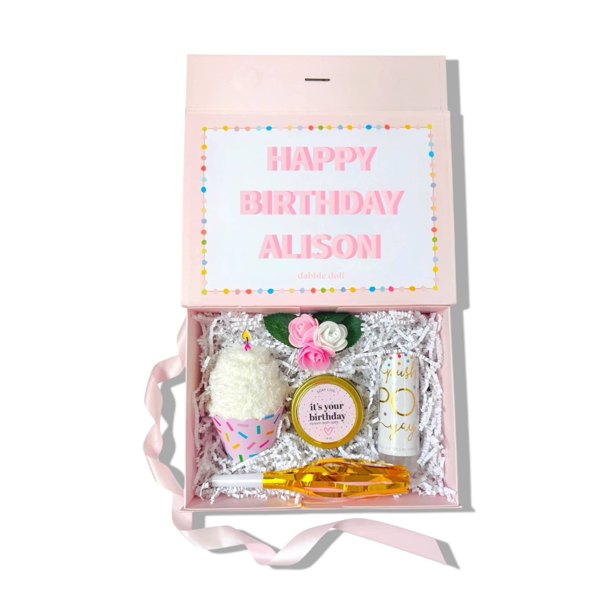 Dabble Doll Birthday Gift Box featuring decorations, candles, and personalized items for a festive celebration
