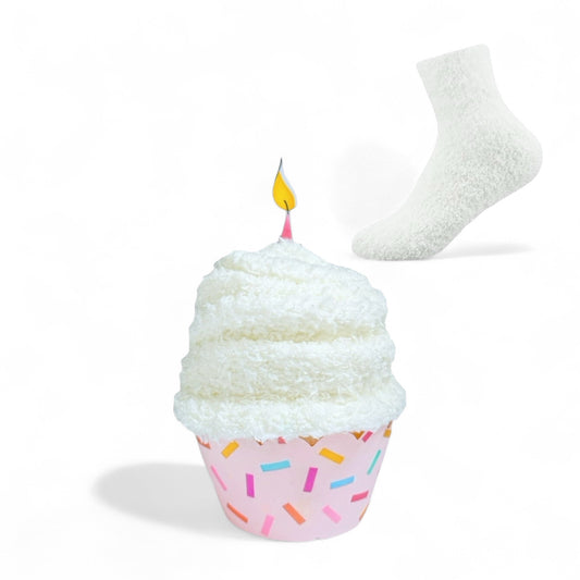 Dabble Doll birthday gift socks packaged to look like a cupcake with a pink confetti wrapper and white fuzzy socks