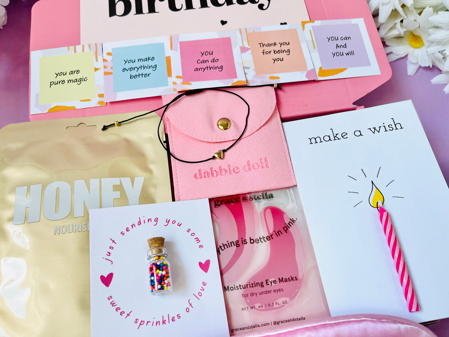 Dabble Doll birthday gift set with mini card, eye masks, and charms for celebrating someone special
