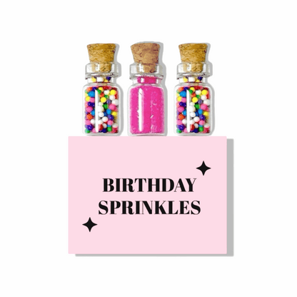 Dabble Doll Birthday Sprinkles set with colorful edible decorations in three glass jars