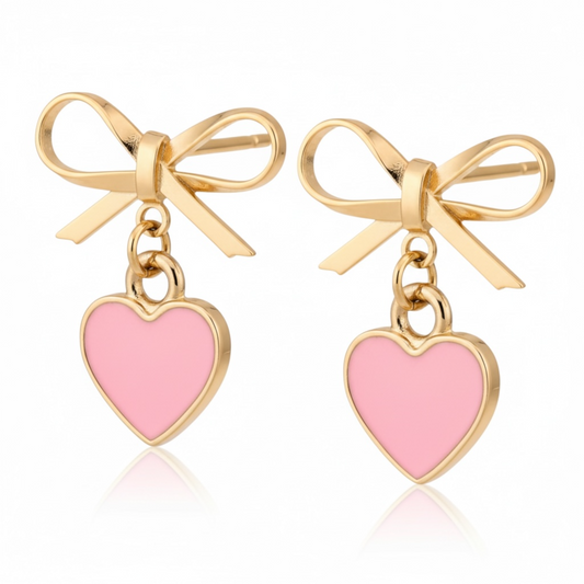 Dabble Doll gold bow earrings featuring pink heart charms for a cute and stylish look