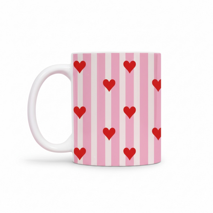 Dabble Doll ceramic mug featuring red hearts on pink striped background