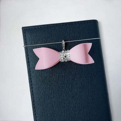 Light Pink Bow Charm for Purse with Silver Accent on a Dark Blue Wallet
