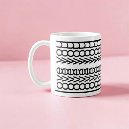 Dabble Doll gift box featuring a stylish coffee mug with a unique black and white design