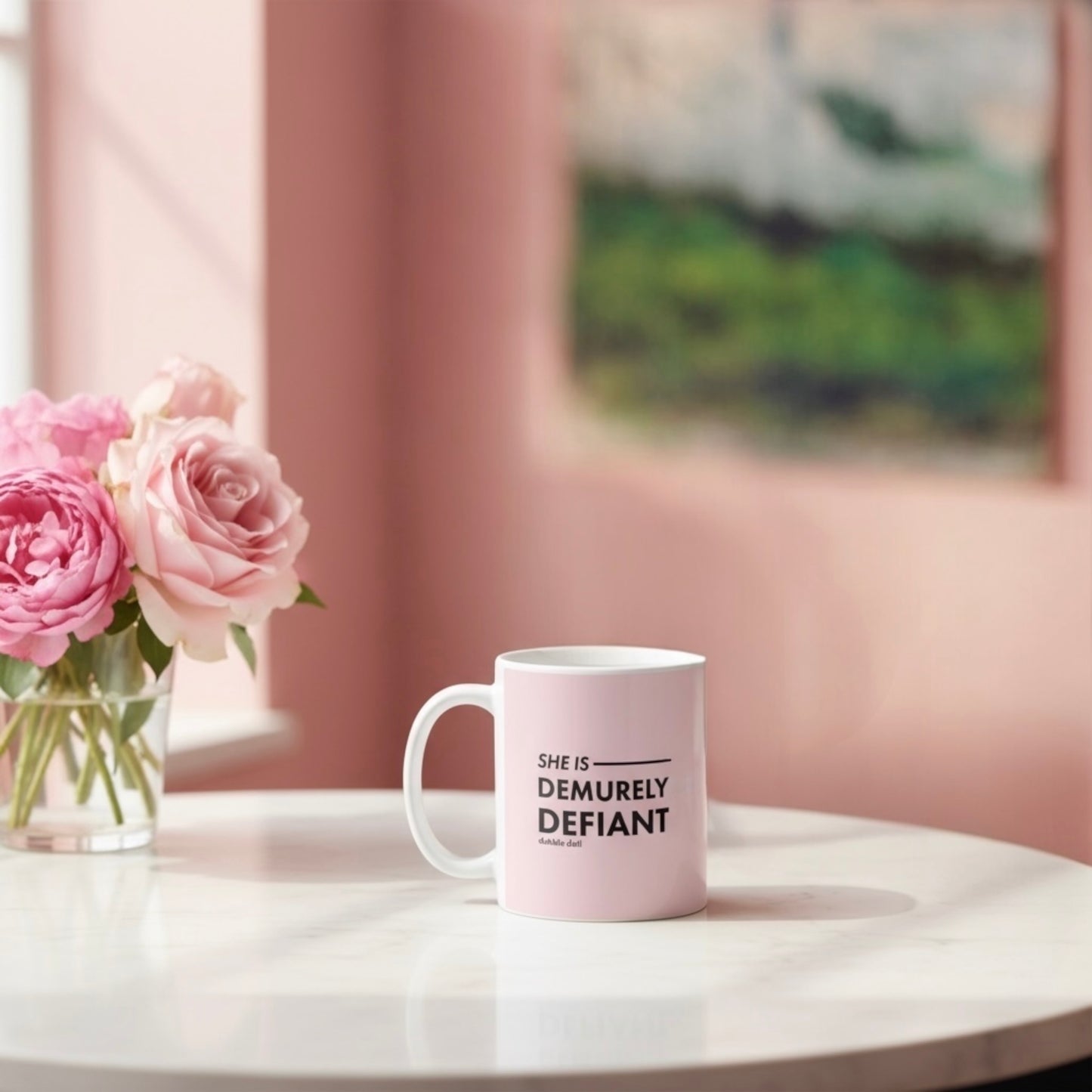 Dabble Doll Gift Box featuring a coffee mug with the phrase She is Demurely Defiant next to pink roses
