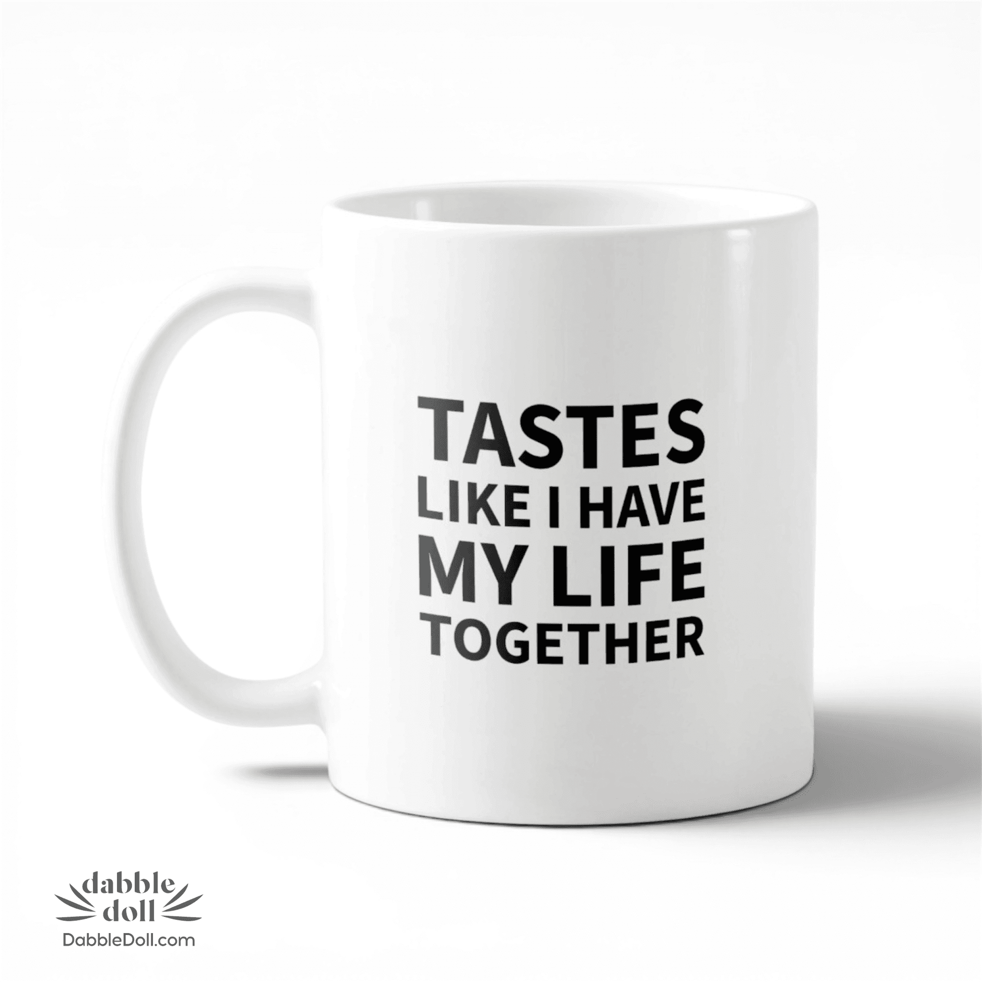 Dabble Doll coffee mug with the phrase 'Tastes like I have my life together' in bold lettering