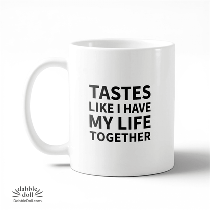 Dabble Doll coffee mug with the phrase 'Tastes like I have my life together' in bold lettering